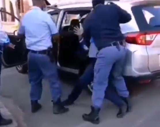 Schoolgirl being dragged by police